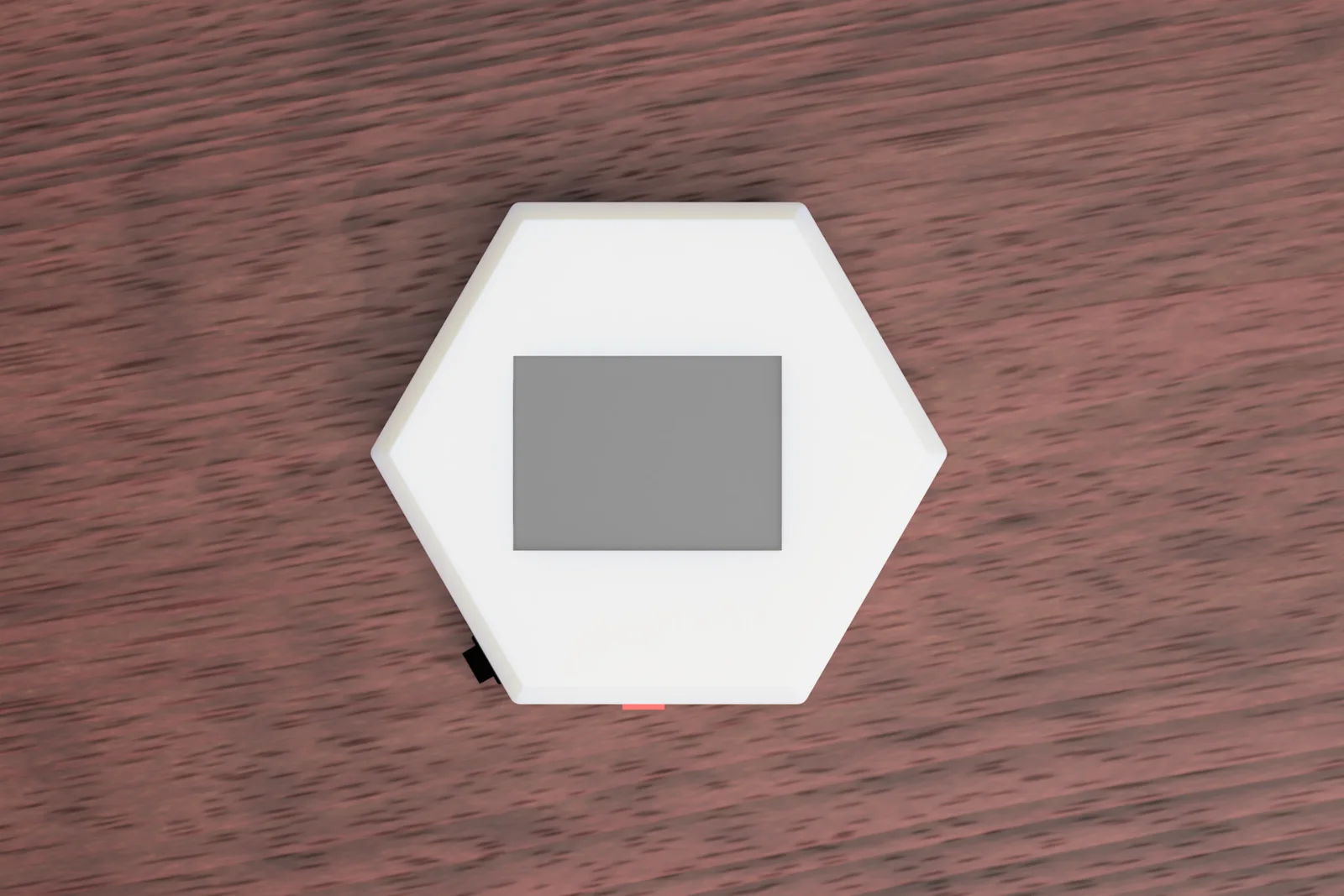 Top view of the Nimbus device showing its hexagonal shape and screen.